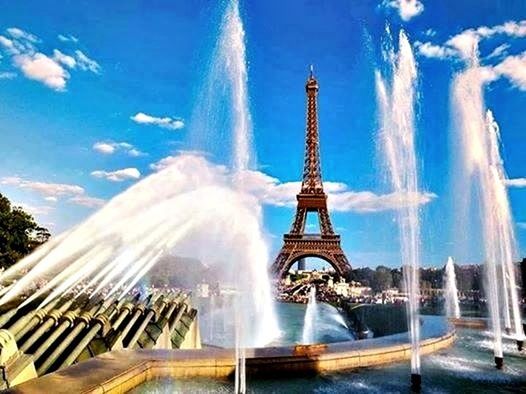 built structure, architecture, famous place, international landmark, building exterior, travel destinations, capital cities, tourism, low angle view, blue, city, travel, sky, fountain, tall - high, tower, modern, spraying, motion, skyscraper