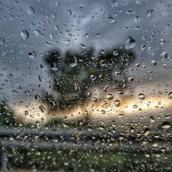 Full frame shot of wet glass window in rainy season