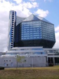 Low angle view of building against cloudy sky
