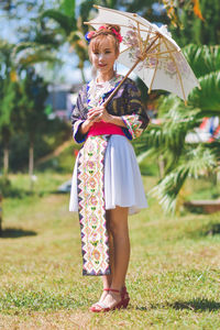 Full length of woman standing on field