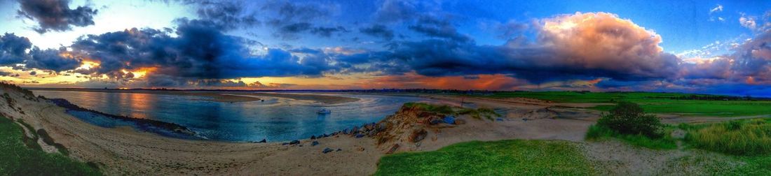 Scenic view of sea against cloudy sky