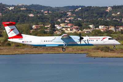 Side view of airplane on airport runway