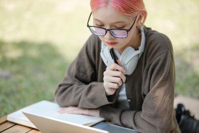 Young woman using mobile phone