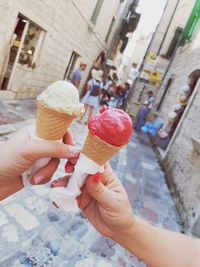 Hand holding ice cream cone