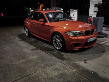 Car parked on street at night