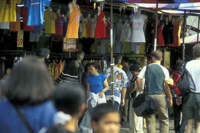 Rear view of people on street in city