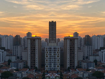 Cityscape against sky during sunset
