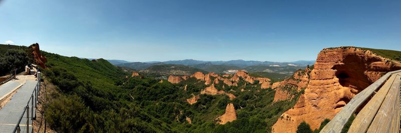 High angle view of mountains against clear blue sky