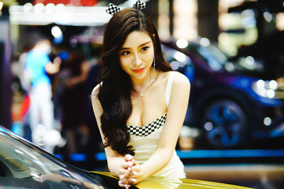 Portrait of a smiling young woman in car