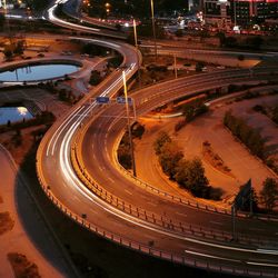 High angle view of light trails on road at night