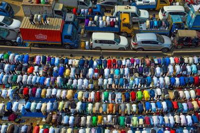 High angle view of multi colored umbrellas hanging in row