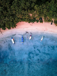 High angle view of people on land by sea