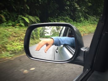 Cropped image of car on road