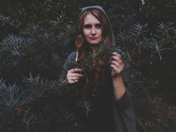 Portrait of young woman in grass