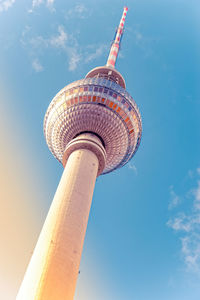 Low angle view of communications tower against sky