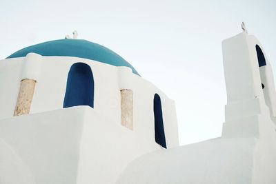 Low angle view of white building against clear sky