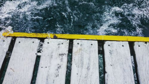 High angle view of wooden pier over lake