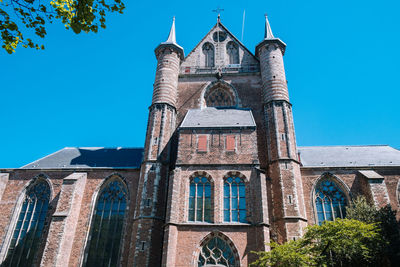 Low angle view of building against blue sky