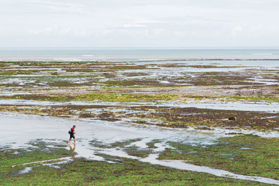 Man looking at sea against sky