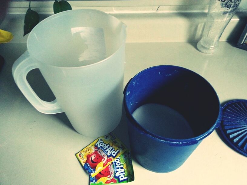 indoors, still life, table, high angle view, close-up, drink, cup, variation, coffee cup, food and drink, no people, plastic, container, blue, spoon, refreshment, bottle, childhood, creativity, hygiene