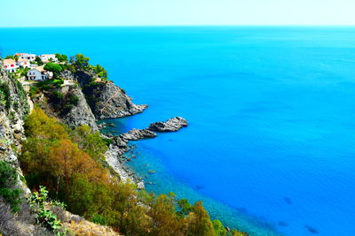 High angle view of sea against blue sky