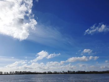 Scenic view of sea against blue sky