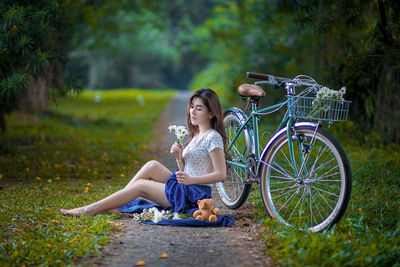 Woman sitting on bicycle