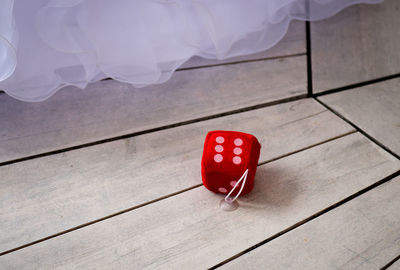 Close-up of dice on wooden floor