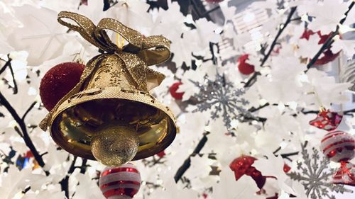 Low angle view of christmas decoration hanging on tree