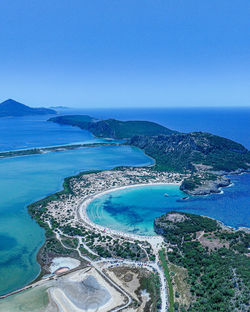 High angle view of sea against clear blue sky