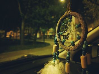 Close-up of dreamcatcher hanging outdoors