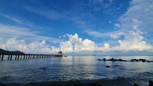 Scenic view of sea against blue sky