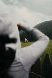 Cropped image of woman standing on road