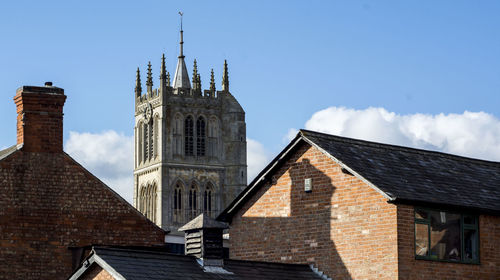 Low angle view of bell tower against sky