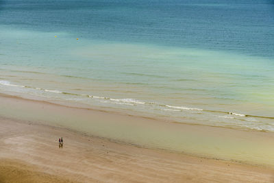 Man standing on beach against sky