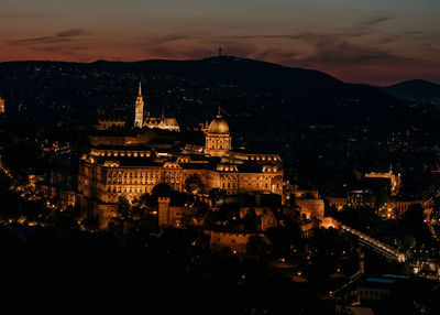 High angle view of buildings in city at night