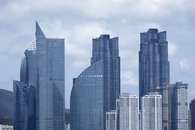 Skyscrapers in city against sky