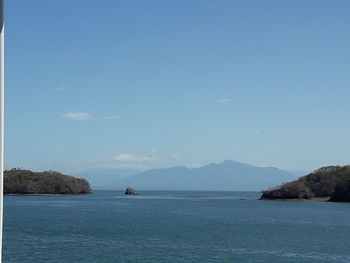 Scenic view of sea against blue sky