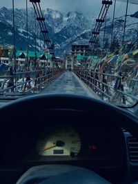 Street seen through car windshield during winter