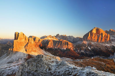 Rock formations on landscape against clear sky