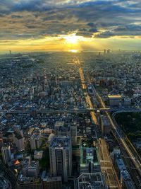 High angle view of city buildings during sunset