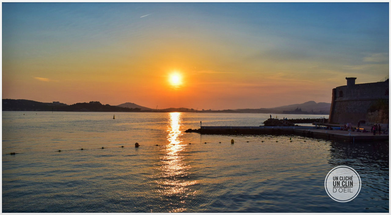 SCENIC VIEW OF SEA DURING SUNSET