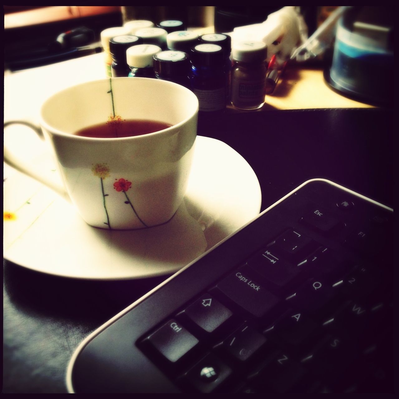 indoors, drink, food and drink, coffee cup, table, refreshment, coffee - drink, transfer print, still life, cup, saucer, coffee, freshness, close-up, auto post production filter, tea cup, frothy drink, spoon, high angle view, hot drink