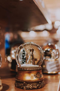 Close-up of glass snow globe on table