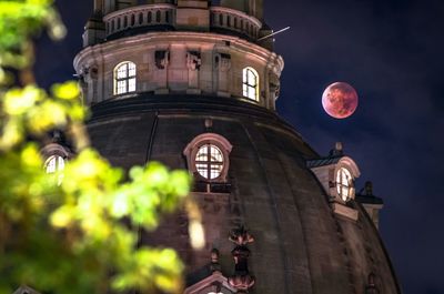 Low angle view of dresden frauenkirche against blood moon night