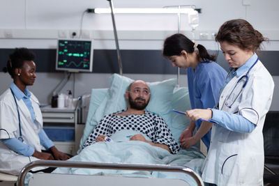 Doctor examining patient in hospital