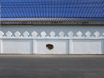 Man on building wall