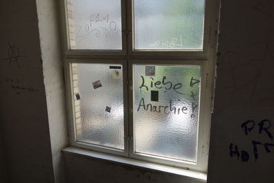 Close-up of text on window