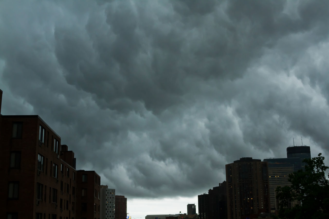 CITY AGAINST CLOUDY SKY