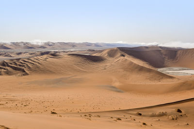 Scenic view of desert against sky